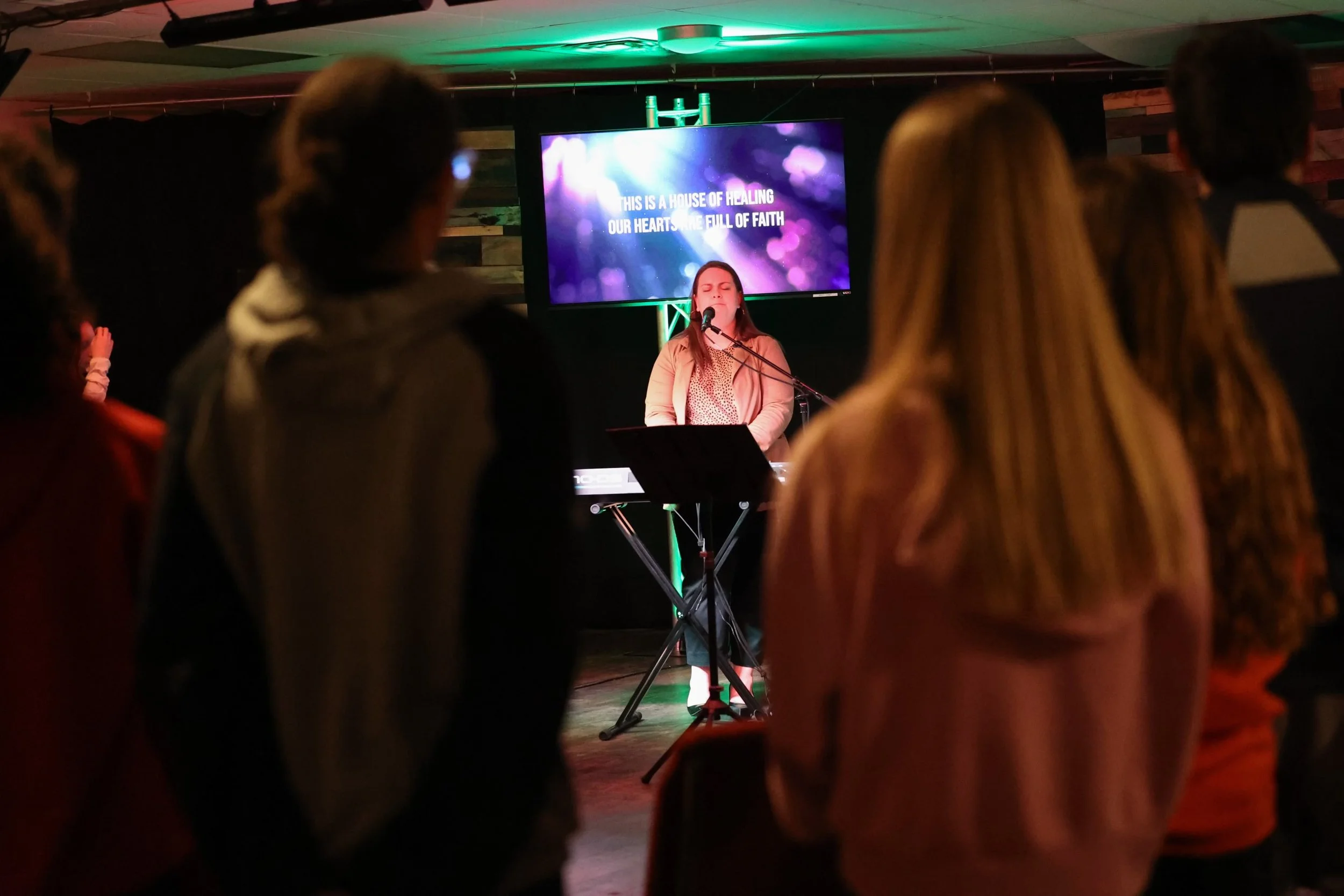 Students worshiping at a LIFE Youth service