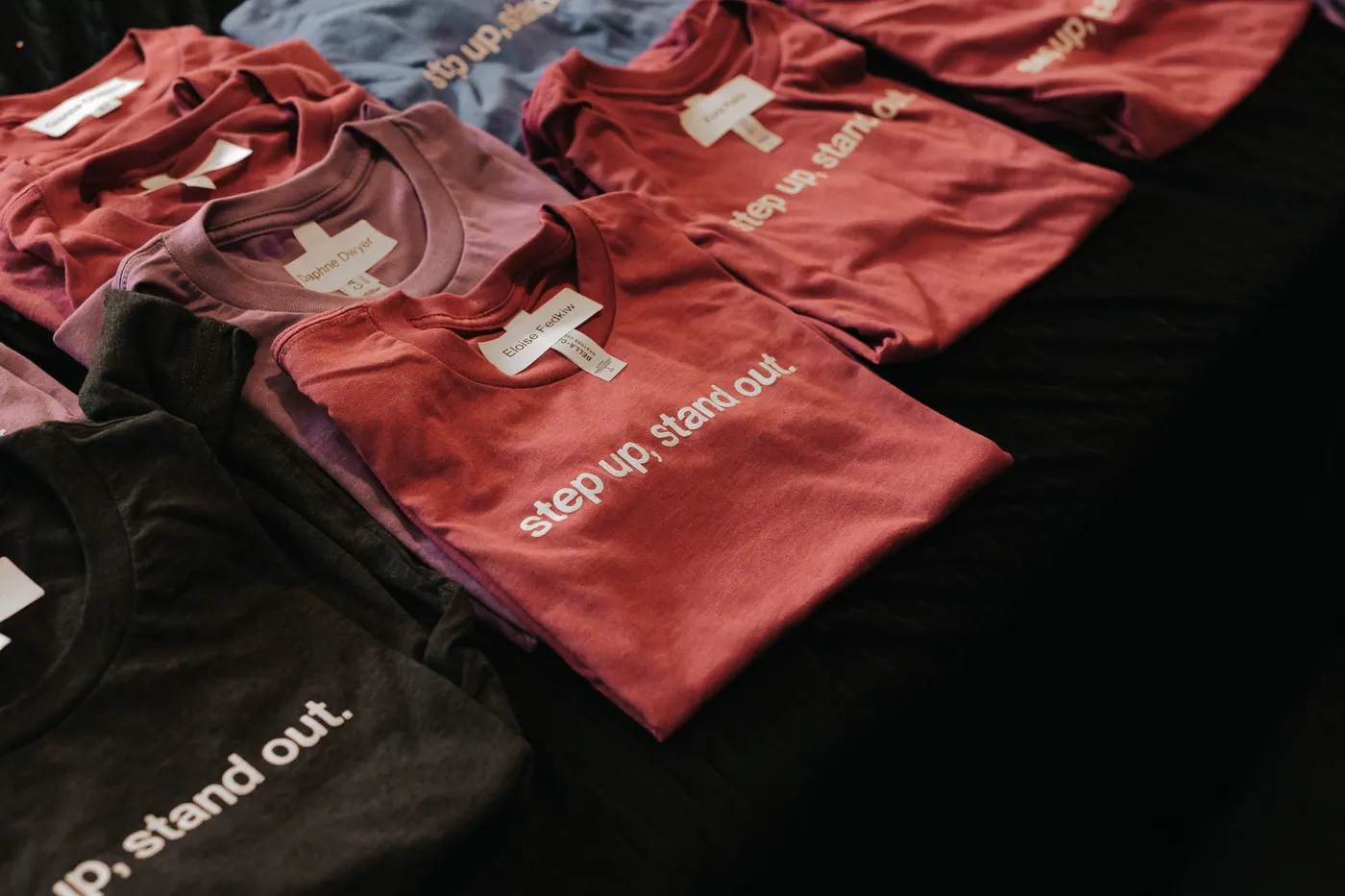 Step up, stand out shirts laid out for students