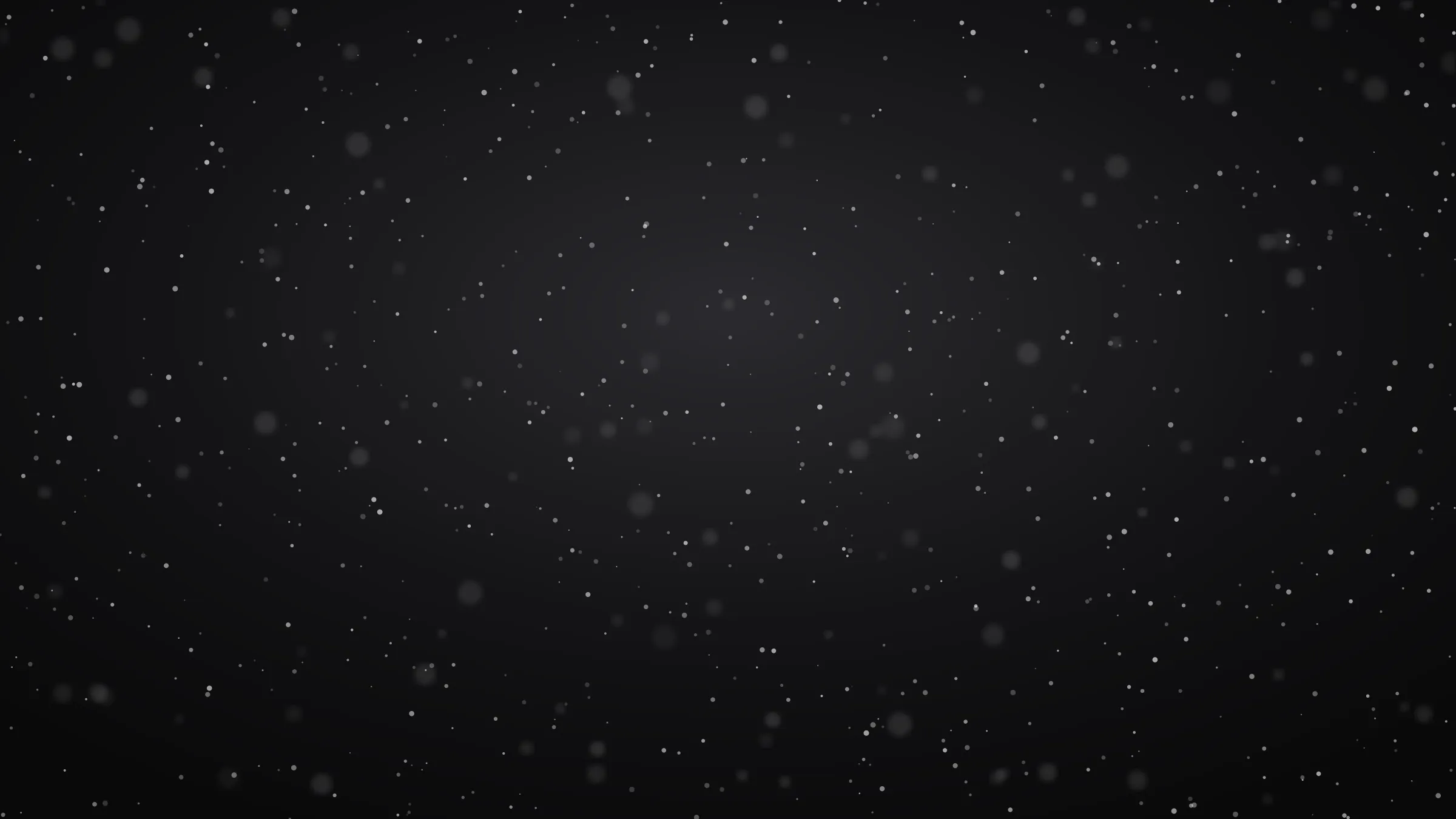 Snow falling against a dark night sky