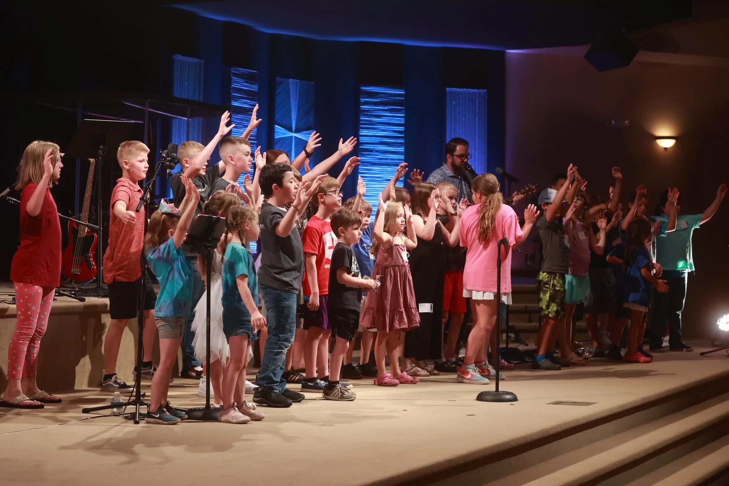 Kids worshiping on stage during a LIFE Kidz service