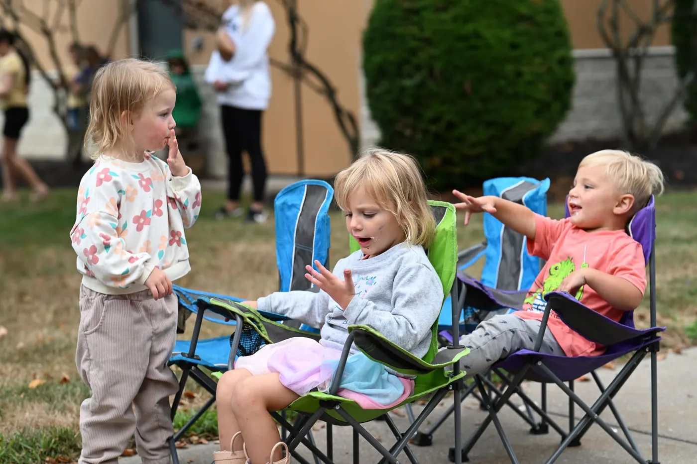 Little ones in camp chairs at a church event