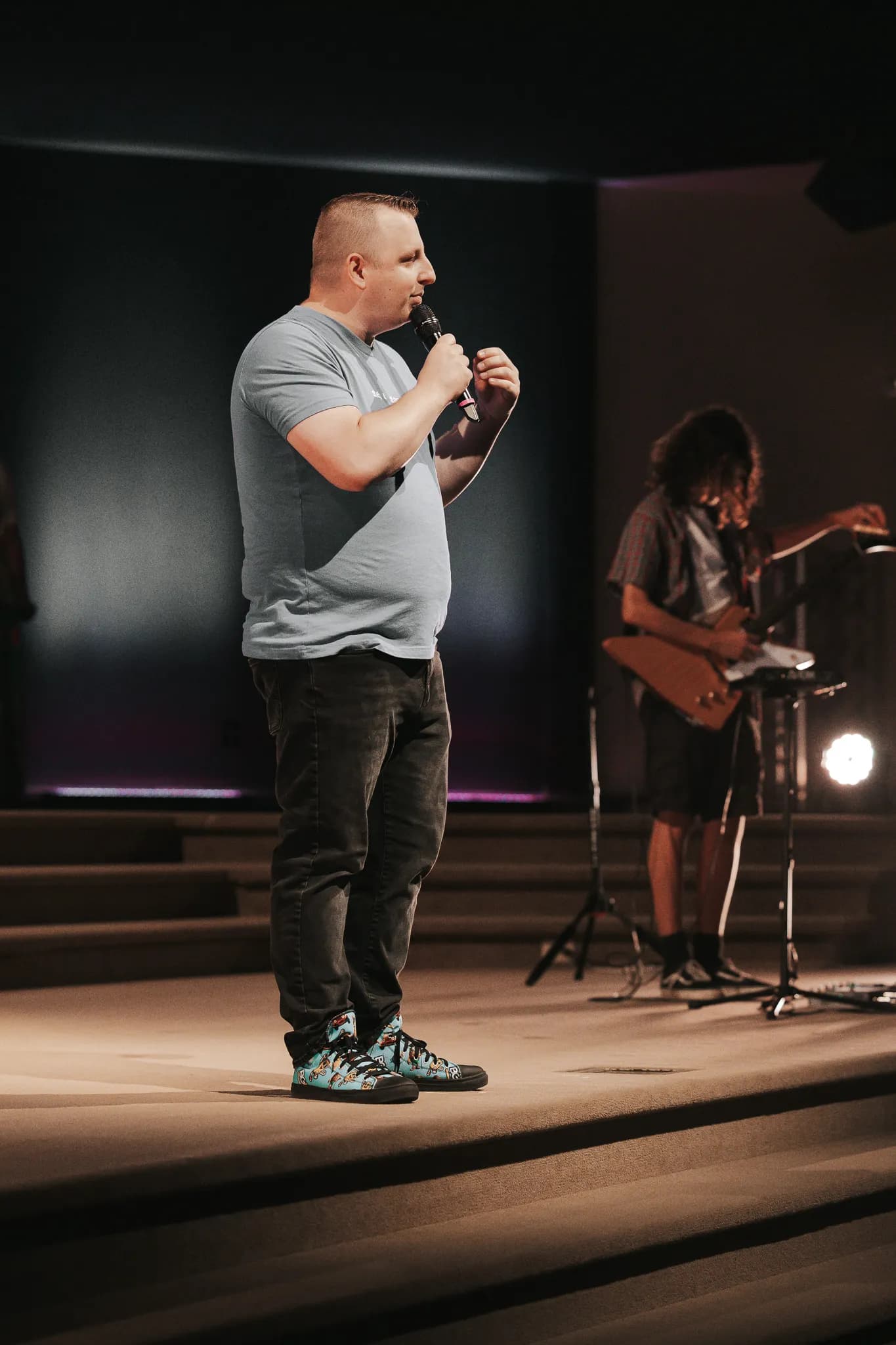 The kids pastor teaching on stage
